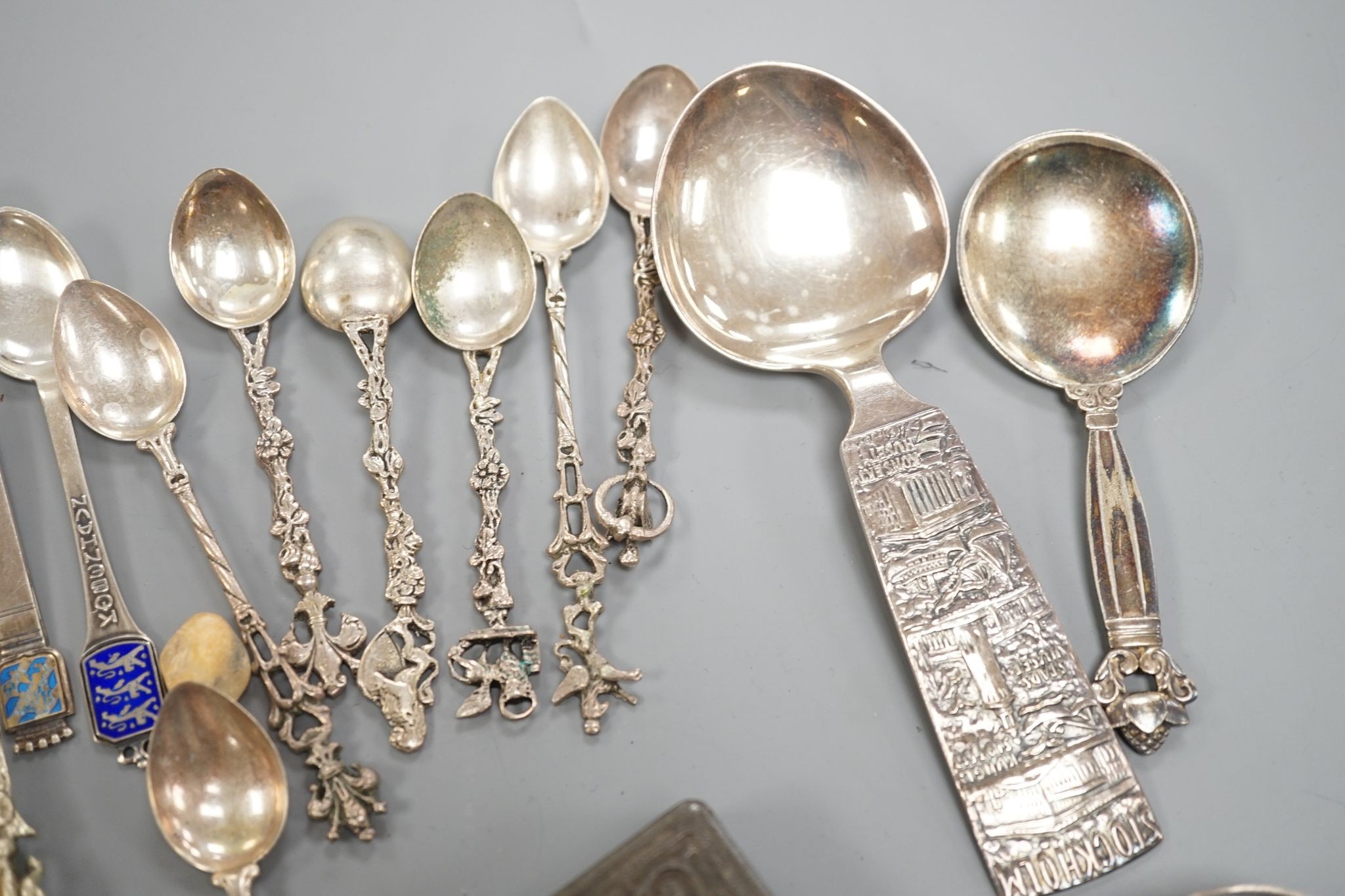 A Georg Jensen & Wendel A/S sterling small spoon, 10.2cm, a pair of antique silver sugar tongs(a.f.), a metal snuff box and a small group of minor spoons including continental white metal.
